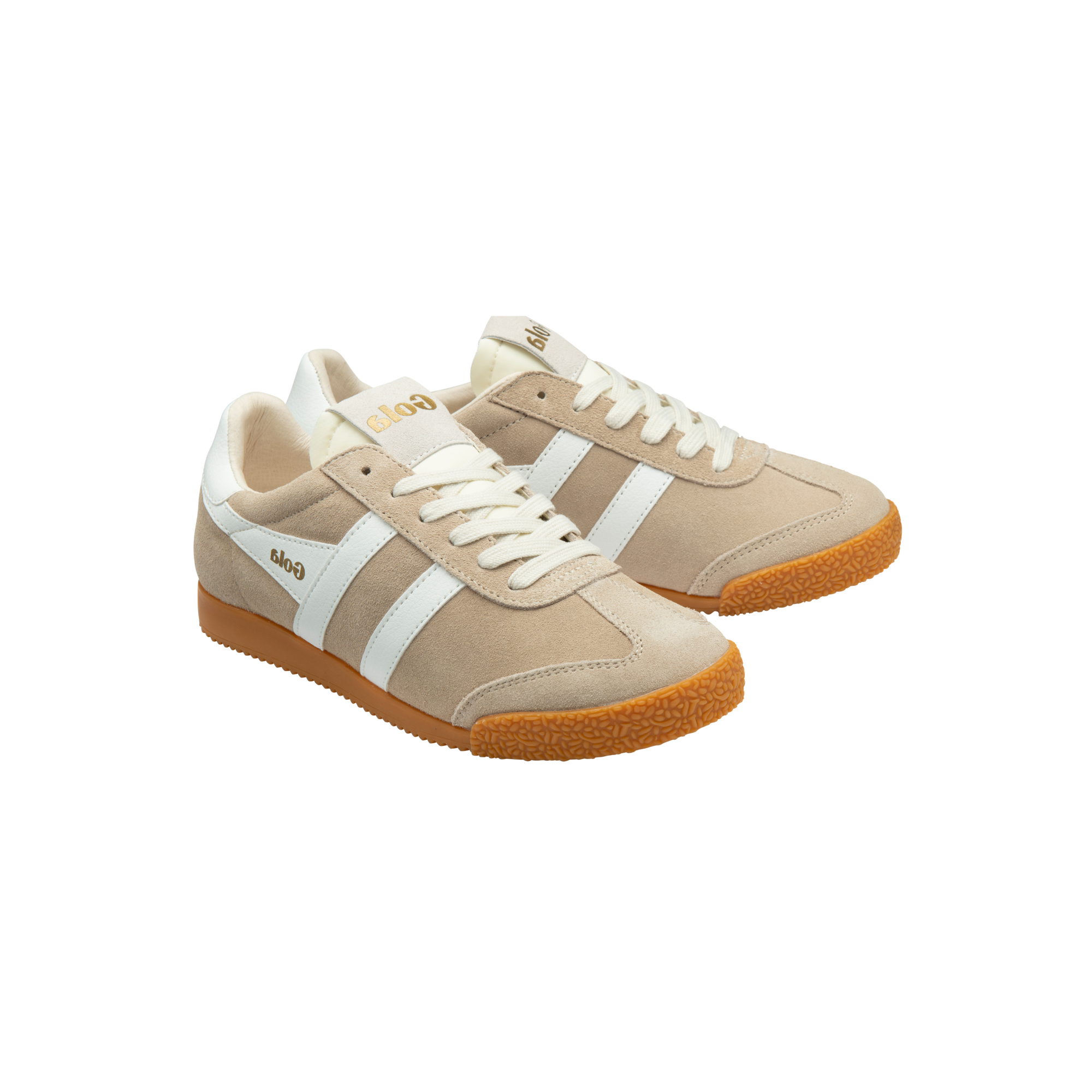 A pair of low-top sneakers in beige suede and leather, featuring white side stripes, white laces, a beige tongue, and a brown gum sole. The brand name 'Gola' is visible on the side of the shoe.