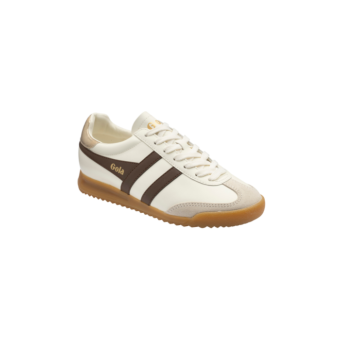 A single low-top sneaker shown from a three-quarters angle on a plain white background. The shoe features an off-white leather upper with dark brown side stripes, a brown heel tab, and a gum brown outsole.