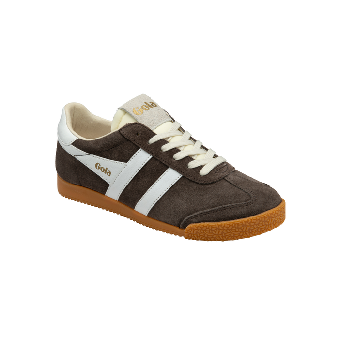 A low-top suede sneaker in dark brown with white side stripes, cream laces, a cream tongue label, and a brown gum sole. The brand name 'Gola' is printed in gold on the side stripe and tongue.